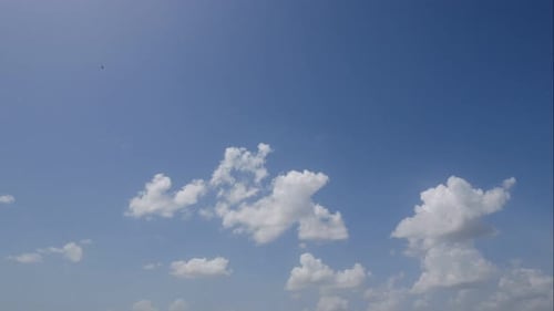 Time lapse of white cloud moving pass around sky background