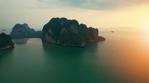 Aerial view over the coast, mountains and beaches during beautiful sunsets