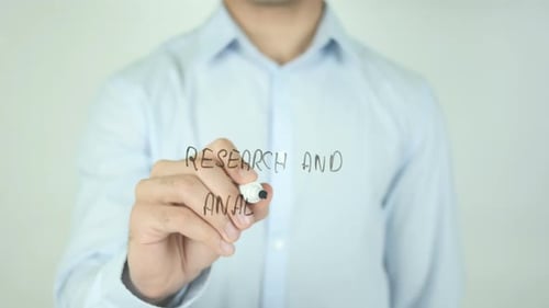 Writing Research and Analysis on Clear Surface