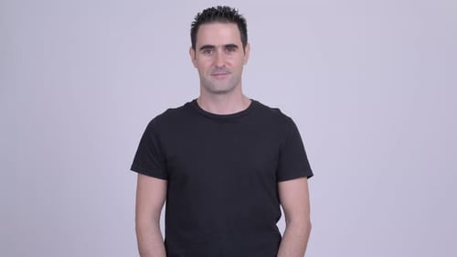 Man Wearing Black Shirt Looking At Camera