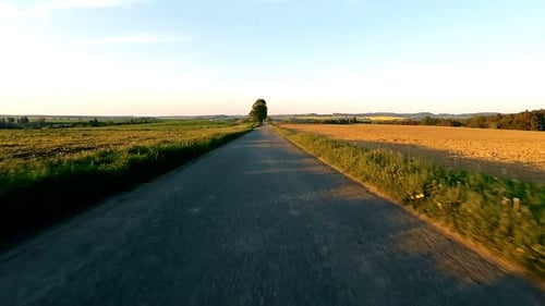 Car driving in spring time in rural countryside
