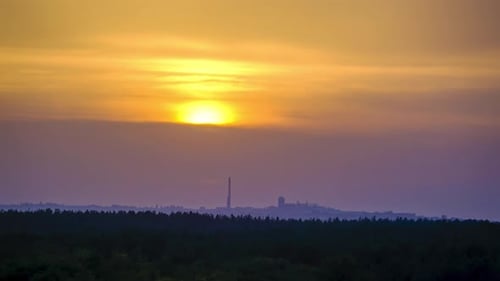 Sunset in the Purple Sky Above the Industrial City with Factory. Timelapse