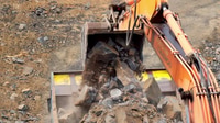 Working mining machines. Quarry mining with heavy industrial machinery ...