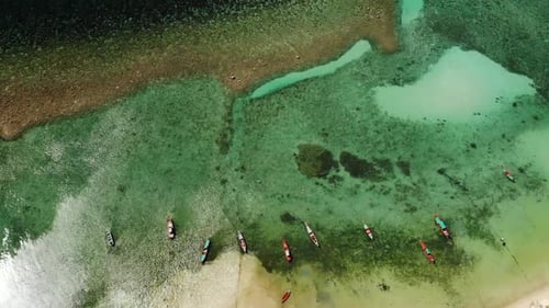 Fishing Boats Near Reef. Beautiful Aerial View of Fishing Boats Floating on Blue Sea Water Near