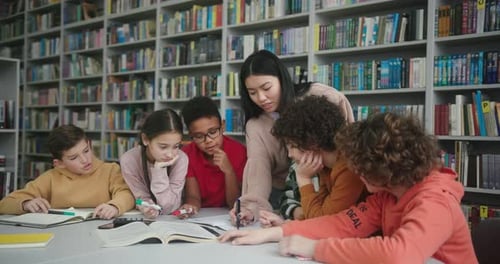 Asian Teacher and Children Rejoice After Completing Project