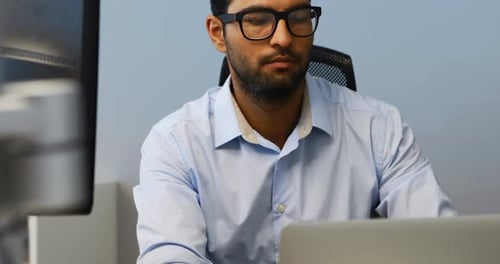 Man Working on Computer at Office Desk