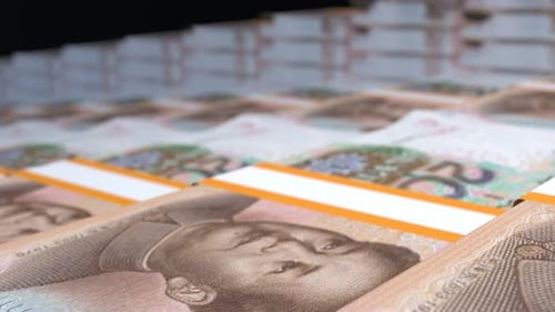 Many wads of money. 20 Chinese Yuan banknotes. Stacks of money.