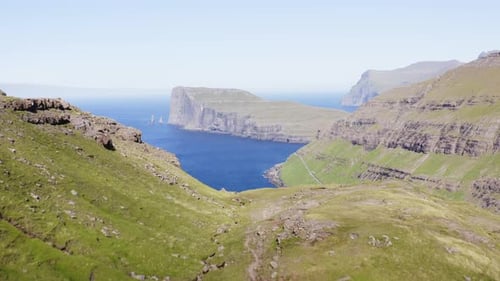 Drone Tracking Shot of Endless Sea Horizon and Beautiful Mountains in Tjornuvik