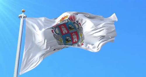 Waving White Flag with Coat of Arms Against Blue Sky
