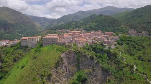 Aerial Medieval Village on Cliff Overlooking Mountain Gorge, Old Town Buildings with Red Tile Roofs