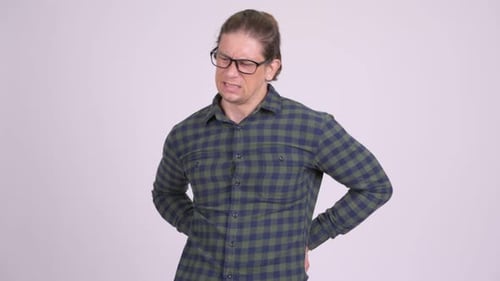 Man Experiencing Back Pain, Holding Lower Back