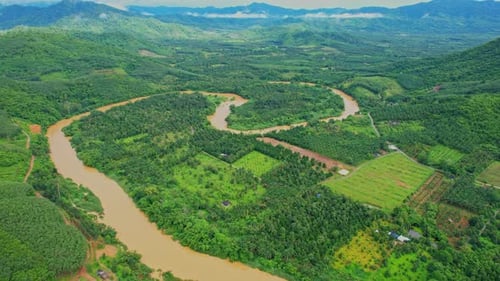 4K : Aerial view over farmland and hill farming