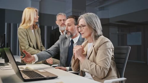 Business People Working Together on a Laptop