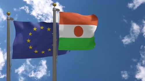 European Union and Niger Flags Waving Against a Blue Sky