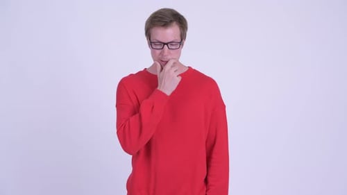 Young Man Ponders in Red Sweatshirt