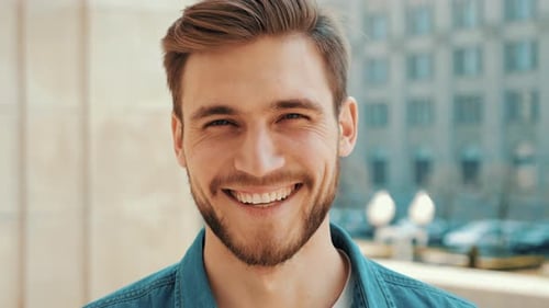Handsome smiling man in casual clothes outdoors