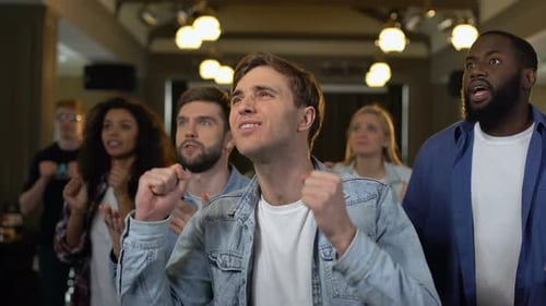 Friends Cheering and Celebrating Together Indoors