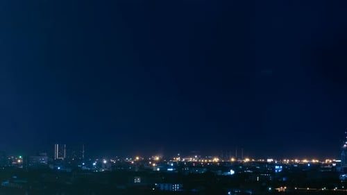 Time lapse raining storm lightning in cityscape at night