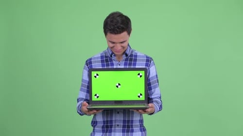 Smiling Man Holding Laptop with Chroma Key Screen