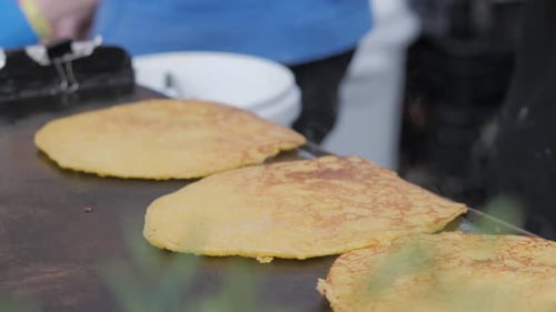 Close up Cooking Flatbread on Griddle at Market