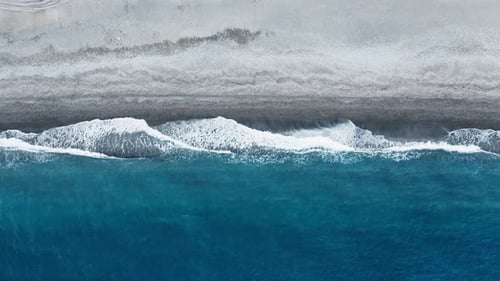 waves breaking on the sandy beach