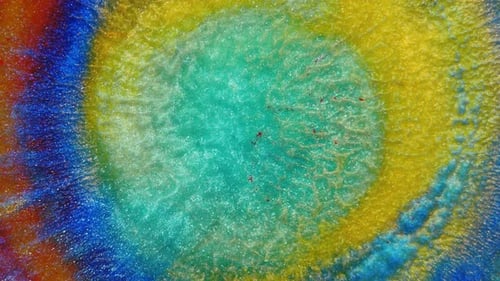 Divergent Drop on a Multicolored Background of Red Blue Yellow Green Colors and Shades