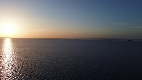 View of the Reflection in the Black Sea Against the Background of the Sky and Sunset