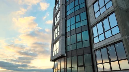 Aerial view of high residential apartment building under construction. Real estate development.