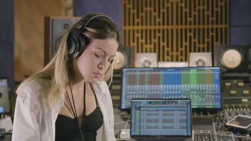 Young Caucasian Woman Working at Music Recording Studio