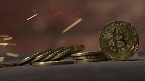 Cryptocurrency on the block chain - close up of bitcoin altcoin physical coins in dynamic setting