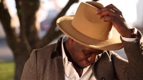 African Man Wear Classical Hat in a City Street