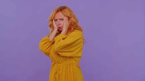 Woman Reacts to News with Shock, Sadness