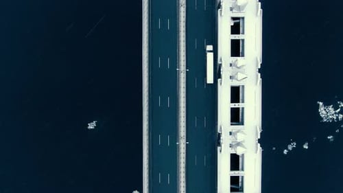 Amazing Aerial View Vertically Down the Highway Across the Bay in Snowfall. Drone Shoot.