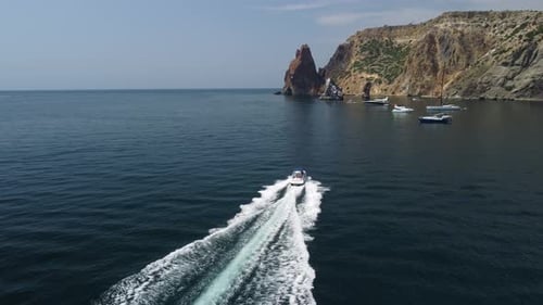 Motorboat Speeding Through Dark Blue Ocean Waters