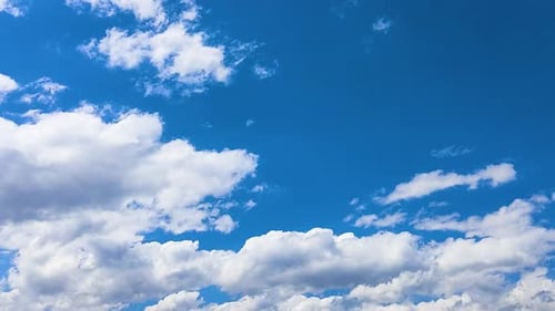Clouds Drifting in a Bright Blue Sky