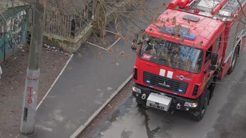New Red Fire Command Vehicle Drives Along Town Street