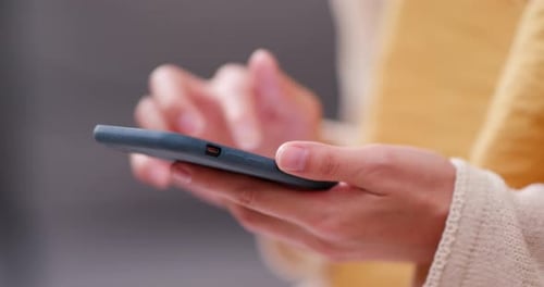 Close Up of Hands Using Mobile Phone