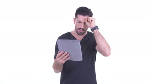 Man With Tablet Computer Giving Thumbs Down