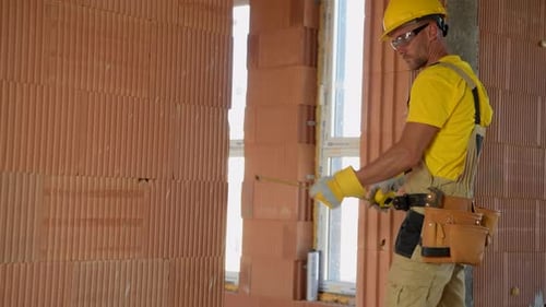 Construction Builder Worker Working Inside Newly Constructed Building