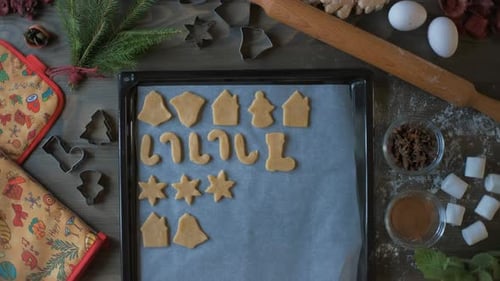 Festive Cookies being Arranged on a Baking Sheet