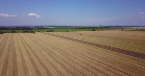 Tractor Farming Aerial on Golden Rural Fields
