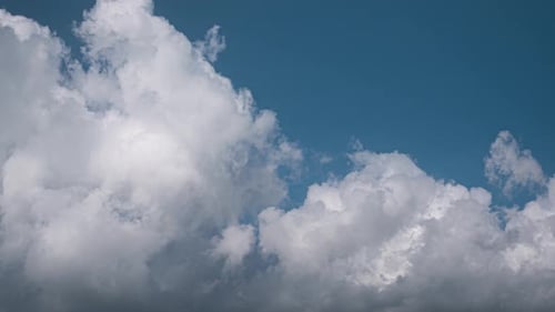 White Clouds Floating Across the Blue Sky