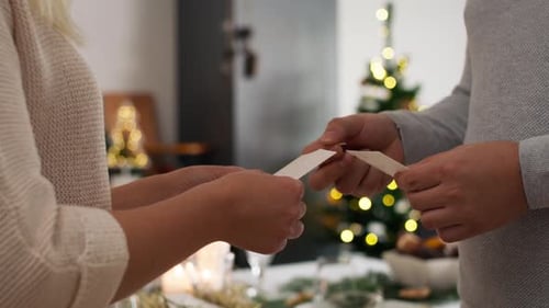 Close up of couple make wishes at Christmas. Shot with RED helium camera in 8K