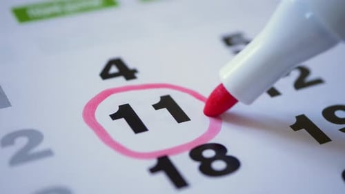 Marking Eleventh Day on Calendar with Pink Circle