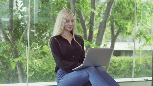 Smiling western business woman, white person working from home
