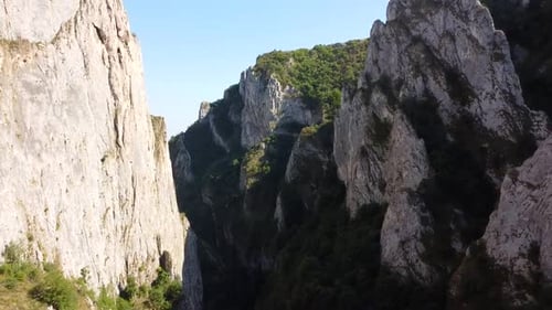 Aerial View of Deep Rocky Canyon with Greenery