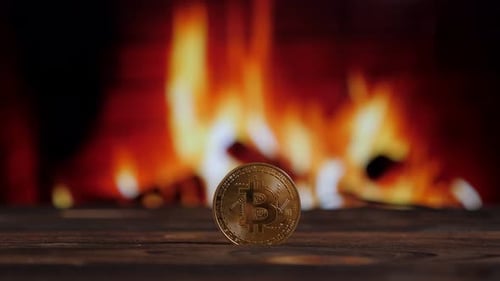 Bitcoin Coin in Front of a Warm Fireplace