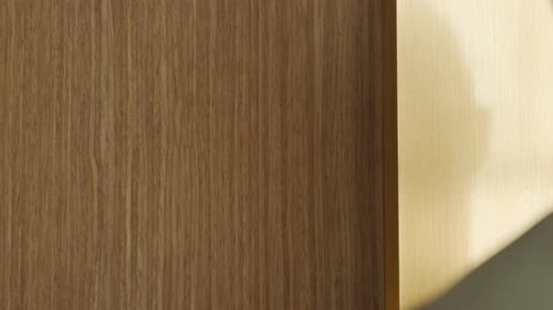 Hand Knocks Firmly on Wooden Door