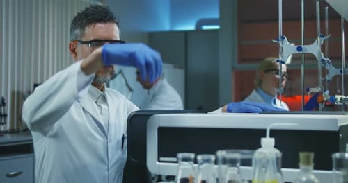 Scientists Working Carefully in Modern Medical Laboratory