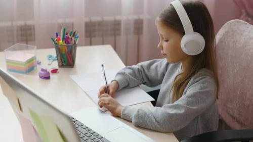 Child Learning Remotely at Desk